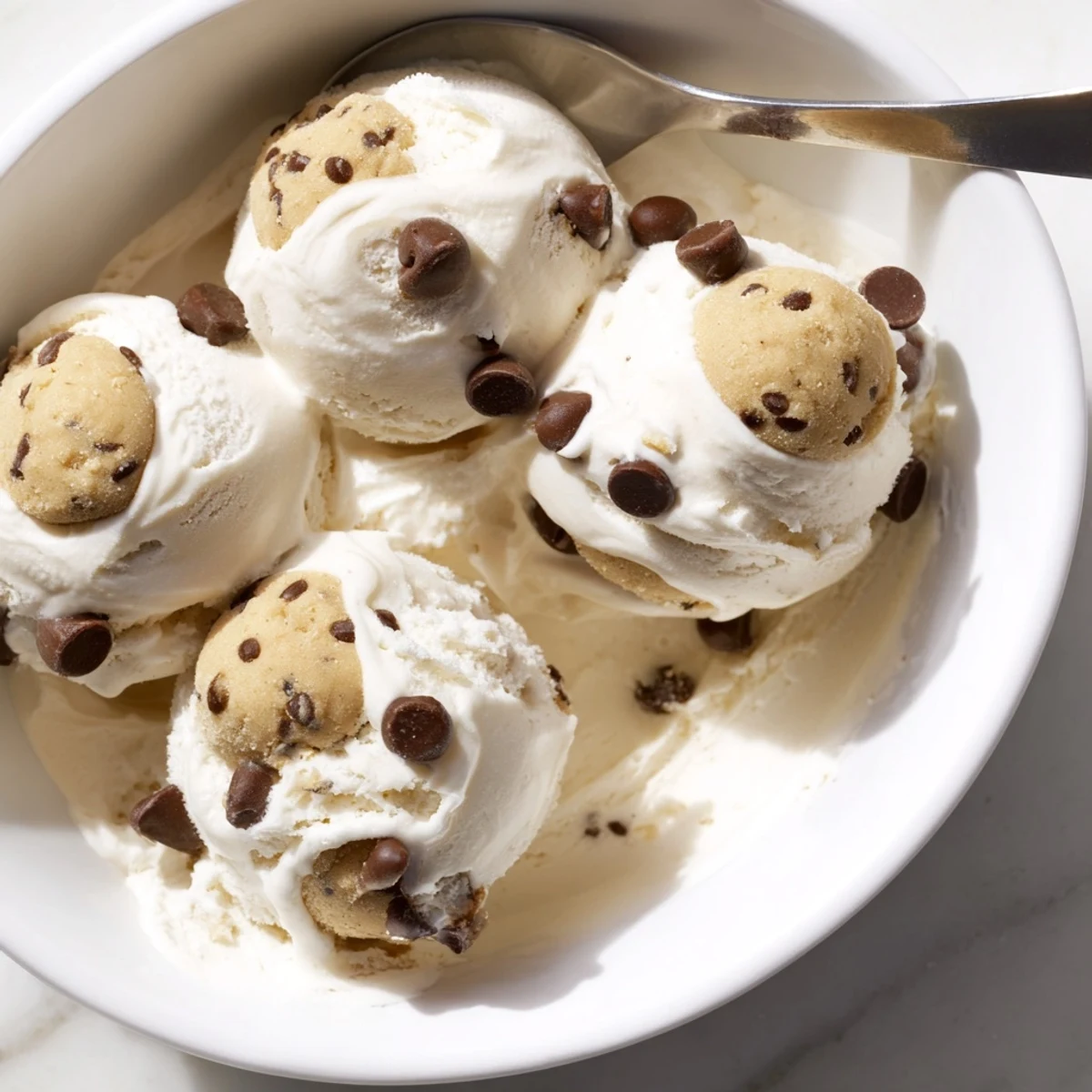 Creamy Cottage Cheese Ice Cream with Cookie Dough, vibrant chocolate chip bites included.  