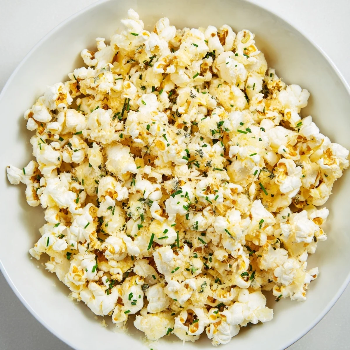 Close-up of Savoury Popcorn Mixes, seasoned with herbs, ready to be enjoyed with friends.
