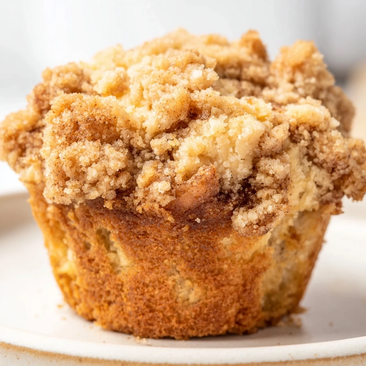 Golden-baked lightened Christmas coffee cake muffins, showcasing a delightful streusel and inviting textures.
