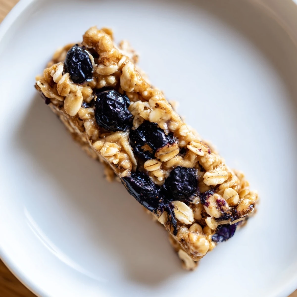 Freshly cut Blueberry Banana Oatmeal Protein Bars, showing a delightful texture and juicy blueberries.