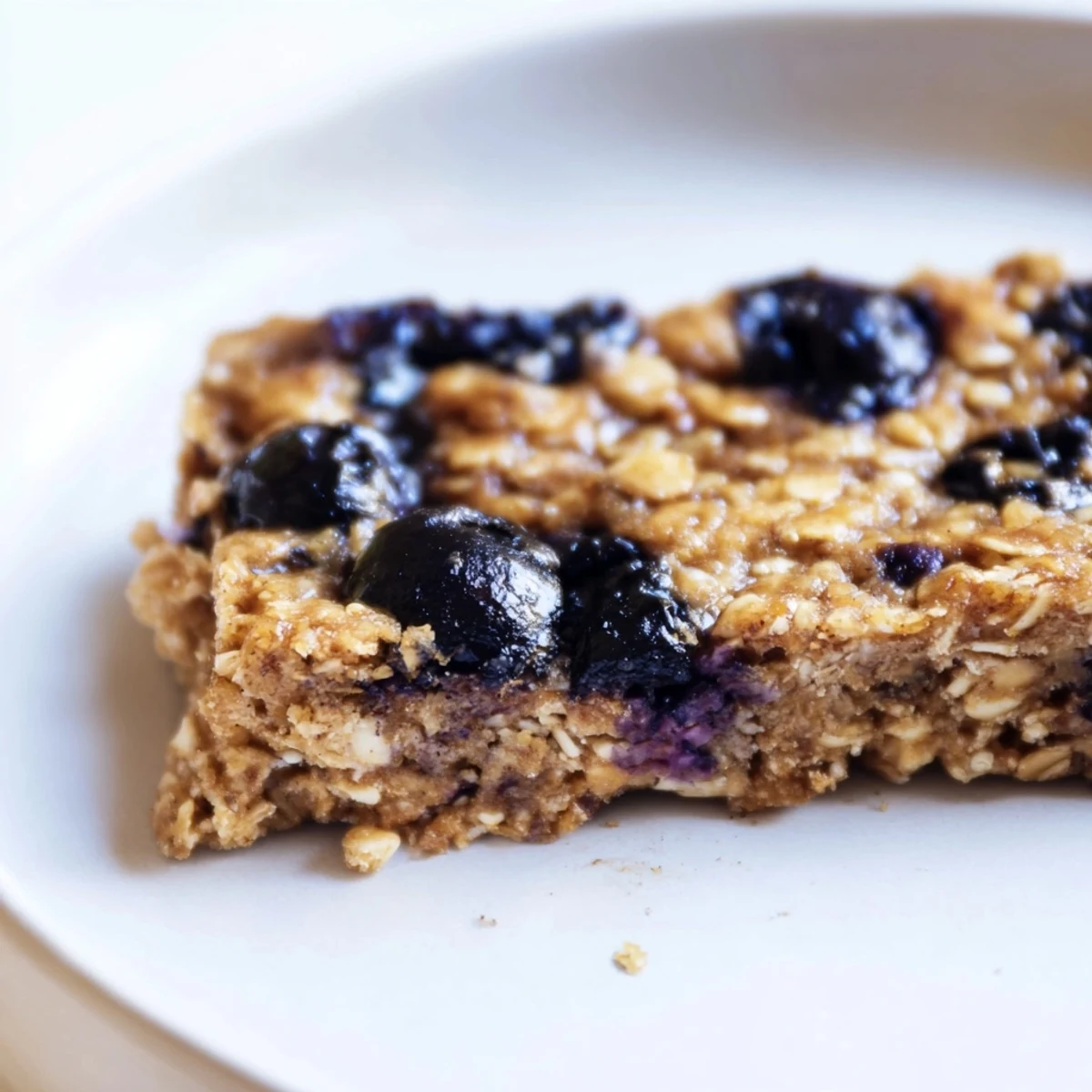 Grab-and-go Blueberry Banana Oatmeal Protein Bars, ideal for a nutritious snack, with perfect golden edges.