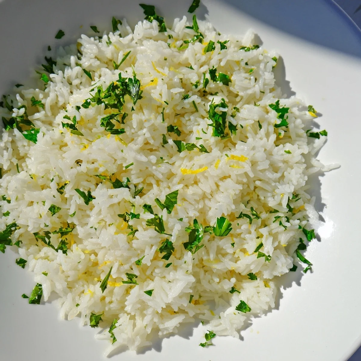 A close-up of vibrant cilantro lime rice, a delicious, refreshing taste of fresh lime and herbs.