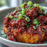 Hearty baked sweet potatoes topped with zesty, classic Sloppy Joe filling.