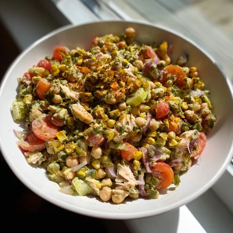Creamy Dense Chickpea and Tuna Salad with bright red onion and parsley, ready to enjoy.
