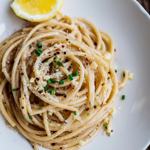 Creamy, glossy miso butter pasta, tossed with garlic and Parmesan; a comforting, umami delight.