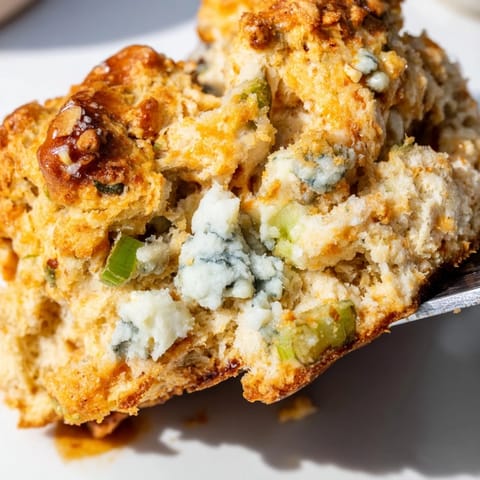 Golden-brown Spicy Buffalo Biscuit Pretzel Scones, bursting with spicy blue cheese flavors.  