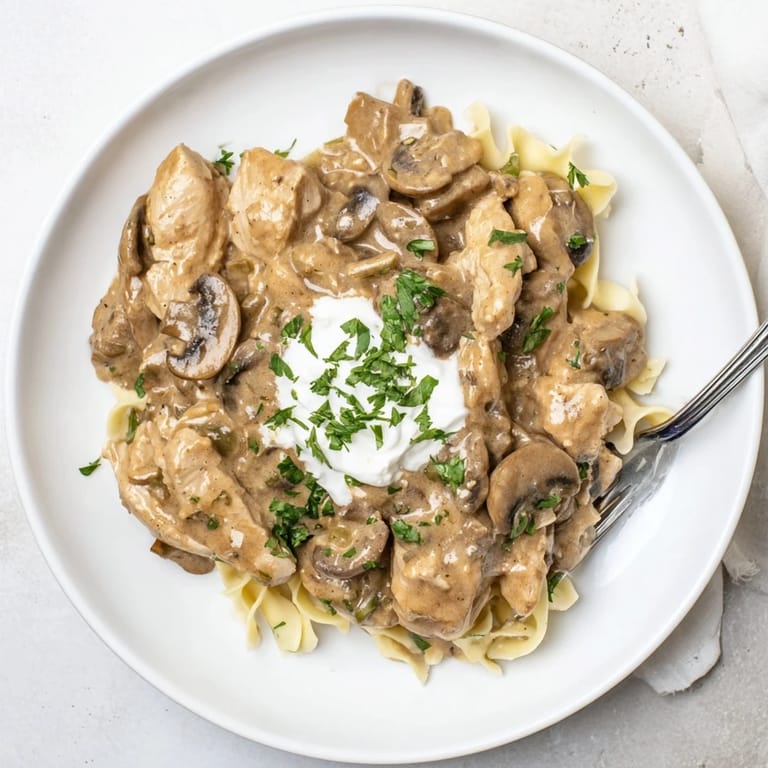 Rich and comforting Creamy Chicken Stroganoff with golden mushrooms and savory chicken.