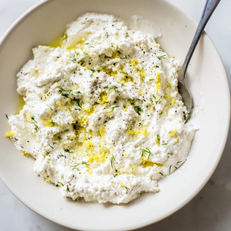 Enjoy this flavorful, smooth whipped feta, drizzled with olive oil, a perfect party appetizer.