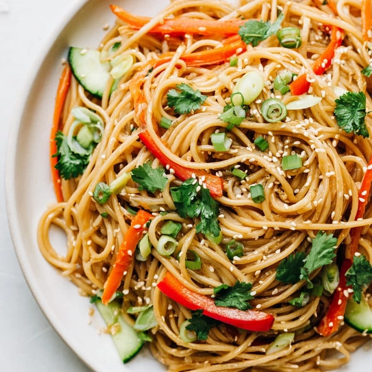 Enjoy a close-up of this delicious Garlic Noodle Salad, a flavorful vegetarian meal, ready to serve.