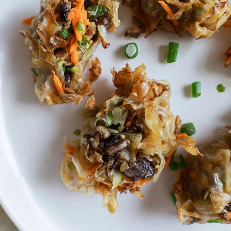 A close-up of savory Crispy Rice Paper Dumplings, perfectly fried and ready for dipping.