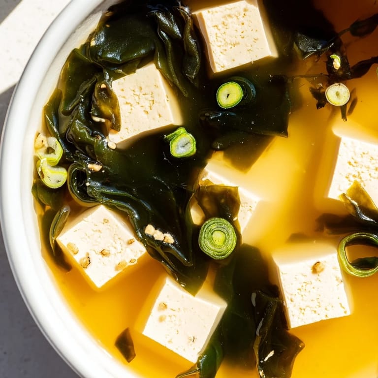 Steaming Japanese Wakame Soup served in a ceramic bowl with tender seaweed, tofu, and a flavorful miso dashi broth.