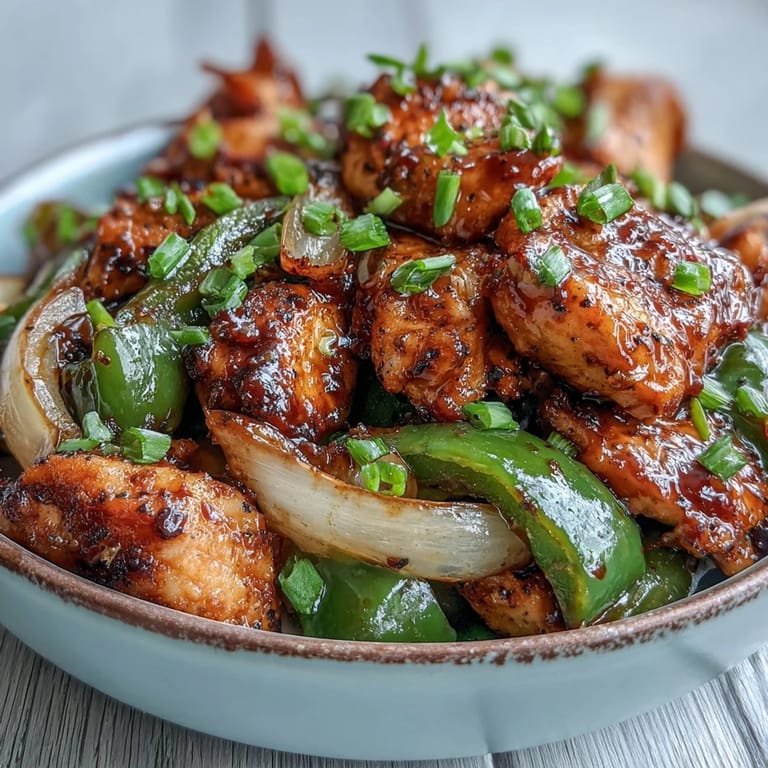 Tender Black Pepper Chicken, crunchy vegetables, and steamed rice make a perfect weeknight dinner.