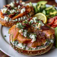 Spring brunch smoked salmon bagel board with cream cheese, capers, and fresh vegetables arranged for easy sharing.
